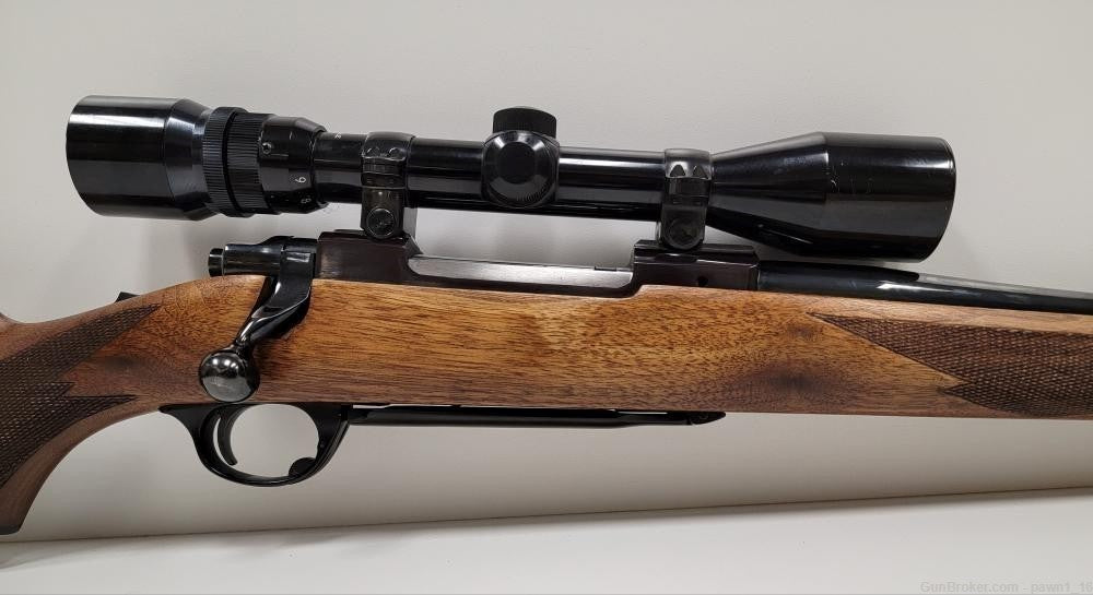 RUGER M77 BLUED 30-06 W/ BUSHNELL SCOPE